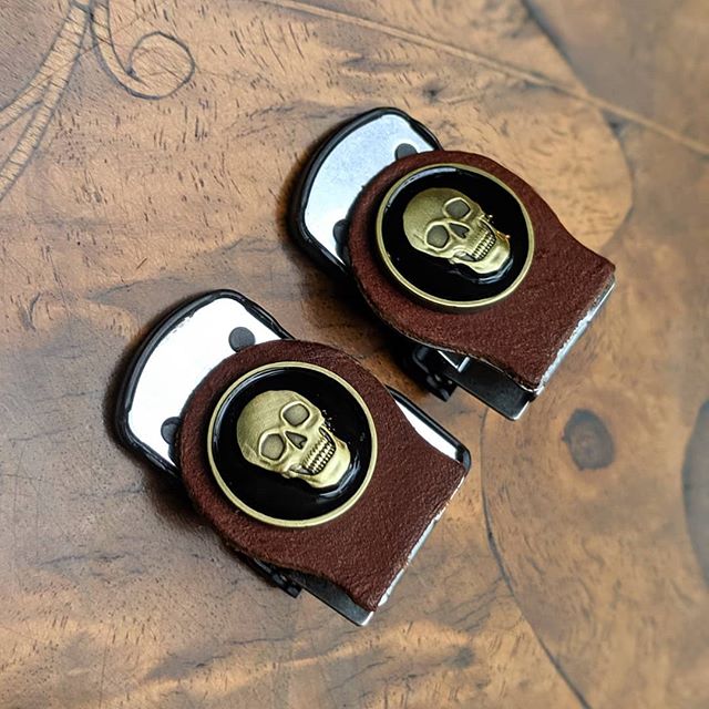 Deadly neat sleeves.  Die cast skulls outfitted on cognac leather.  We make every Sleeve Clip by hand, and all the pieces are customized specifically for our clips -- nothing is "off the shelf." For instance, each piece of leather is cut wi