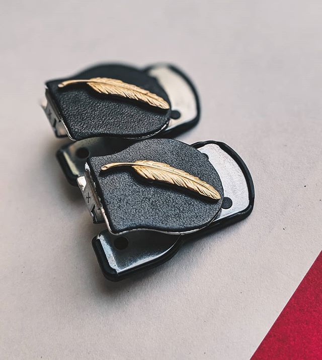 Feathers - new design now available in the Shop!  Stamped brass on genuine leather. Patented clip design for comfortably locking rolled sleeves. #sleeveclips